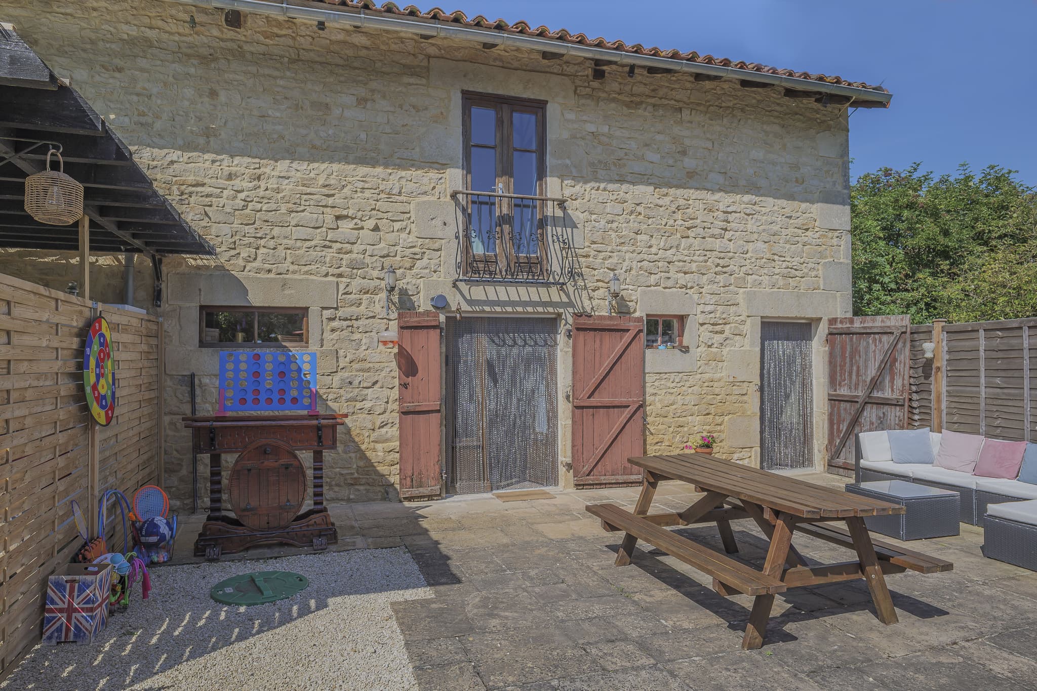 Gite private courtyard and dining area fully secured fencing throughout