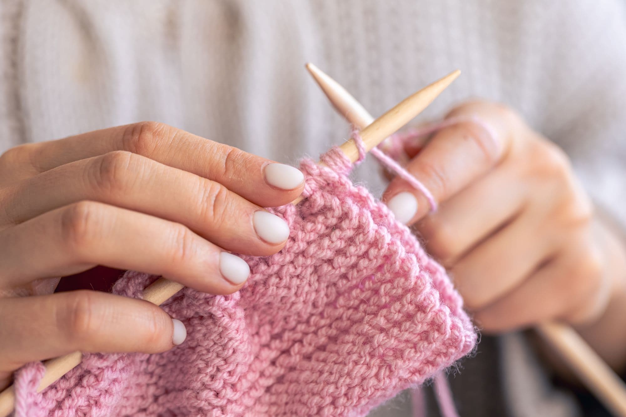 closeup-hands-knitting-using-circular-needles