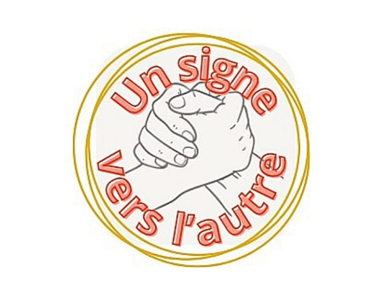 un signe vers l'autre